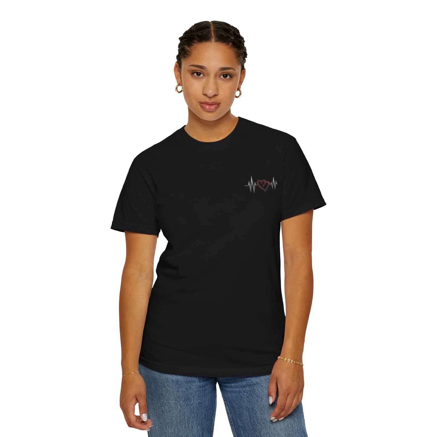Black mashafrica-style heart design t-shirt worn by woman featuring a small red heart with heartbeat line