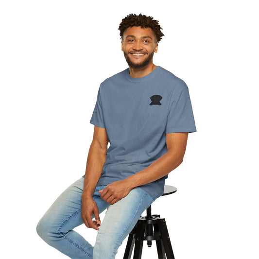 Comfortable pet lover shirt in blue worn by a smiling man seated on a stool