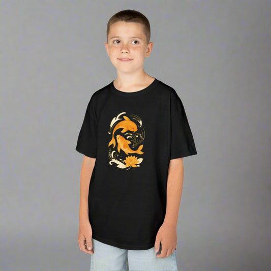 Boy wearing black koi fish graphic tee for kids with orange koi fish and floral design