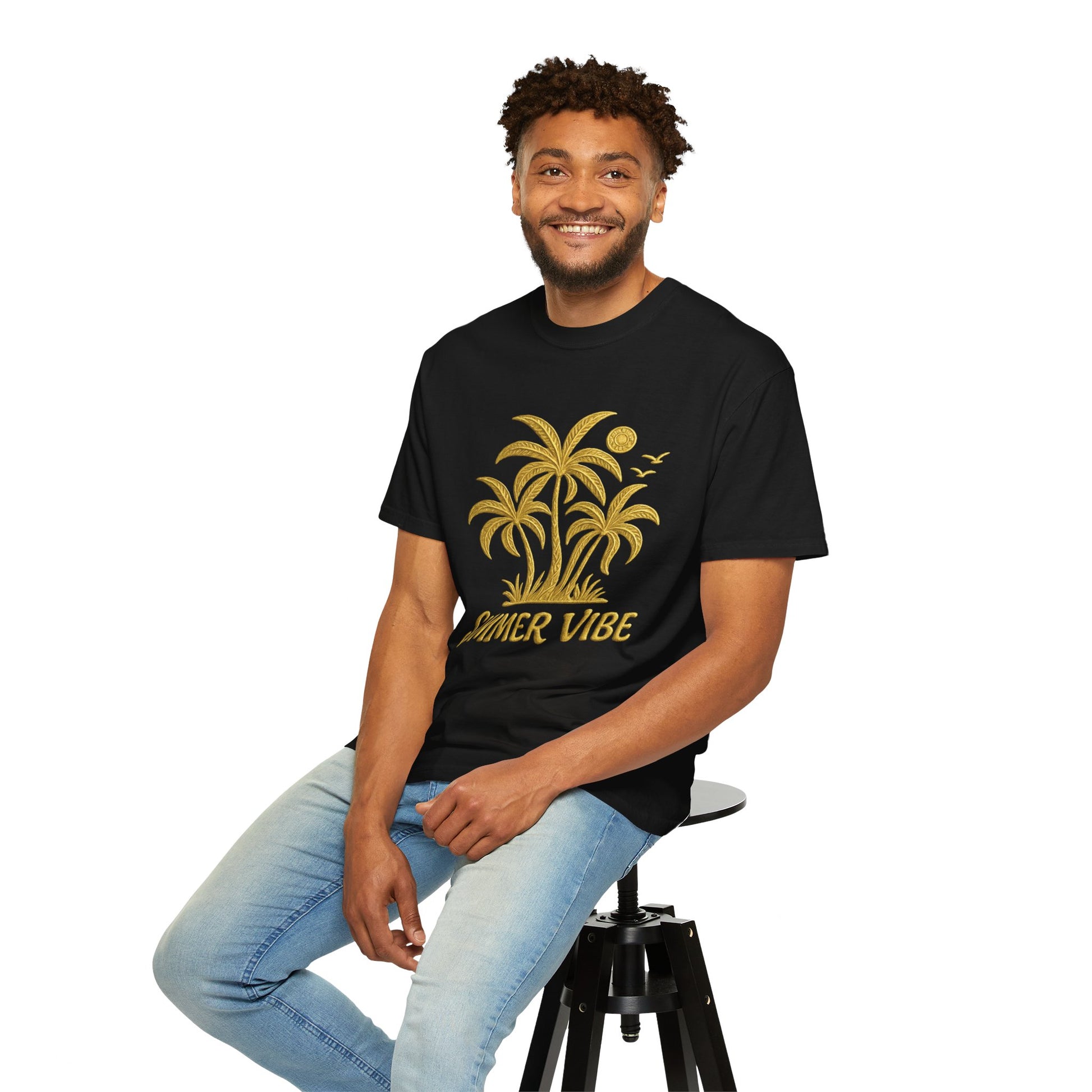Mashafrica-style black summer vibe t-shirt with gold palm tree design worn by smiling man